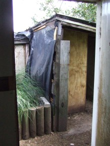 A 'before' photo from the garage side door. The chicken coop I built is under the roof on the right.